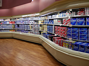 A grocery store with shelves full of soda.