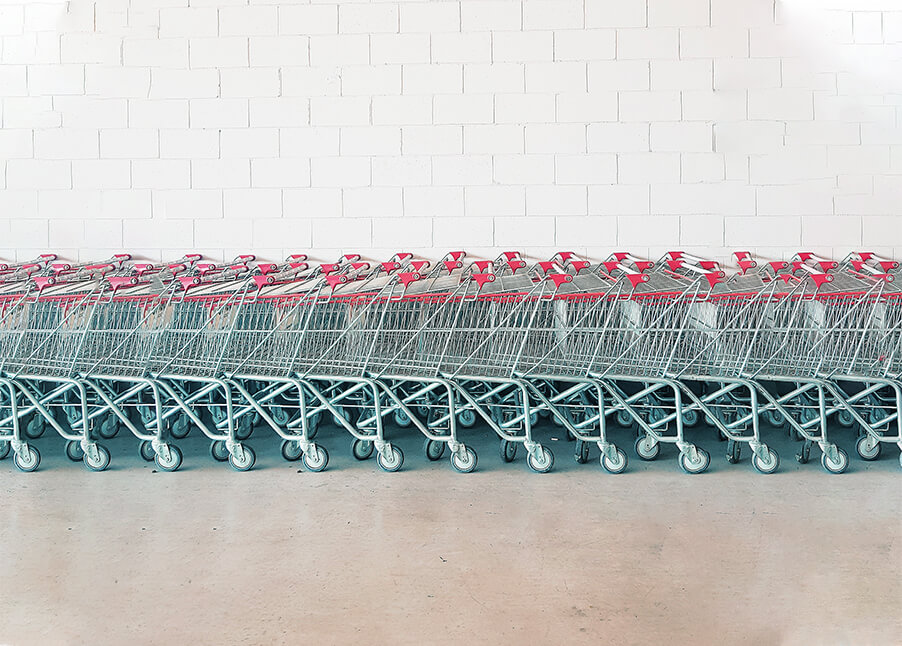 A bunch of shopping carts lined up in a row